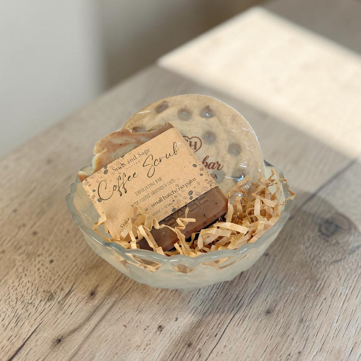 Vintage rose glass bowl filled with Coffee Scrub and Chocolate Chip Cookie Bar artisan soaps, styled as a thoughtful gift set.